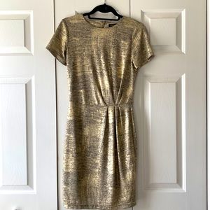 Black and gold form fitting shimmer dress
